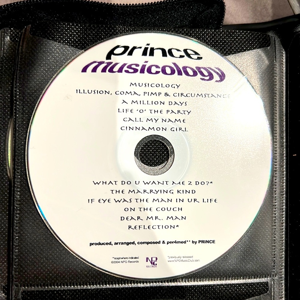 CDs - two Prince CDs.  Purple rain and musicology.